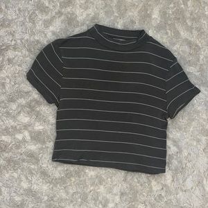 This is a very soft crop top that’s a very muted olive green